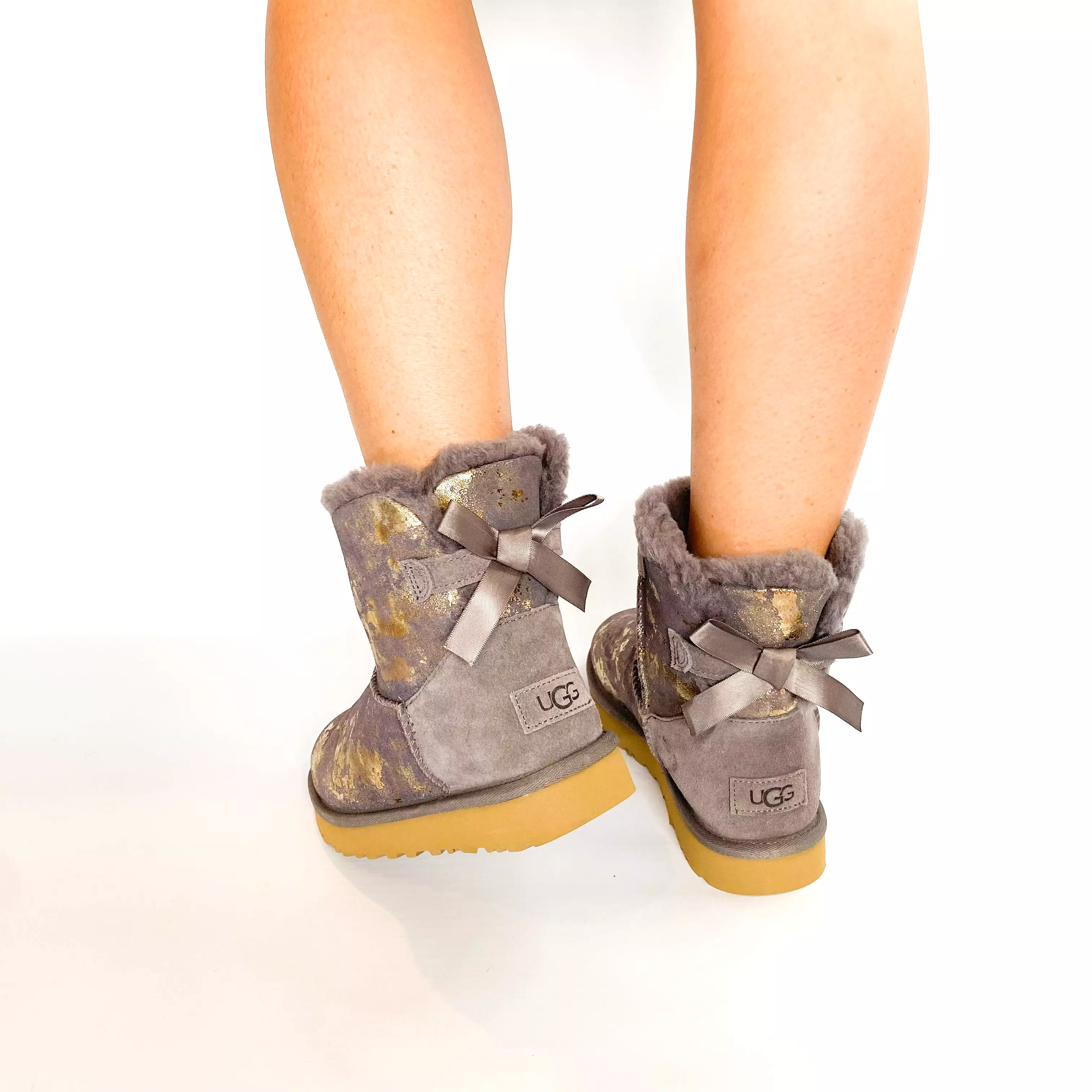 UGG grey mini bailey bow gold wash boot